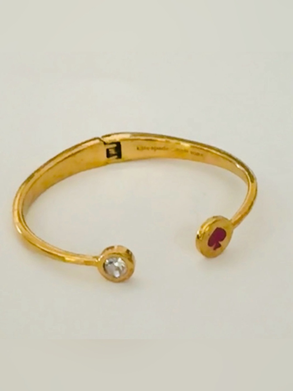 Kate Spade New York
"Spot the Spade" Gold Open Hinge, Pinkish
Red